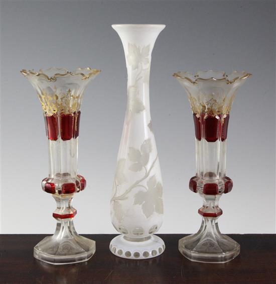 A pair of Bohemian vases and a a similar white overlaid glass, late 19th century, 23.5cm (9.25in.) & 29.5cm (